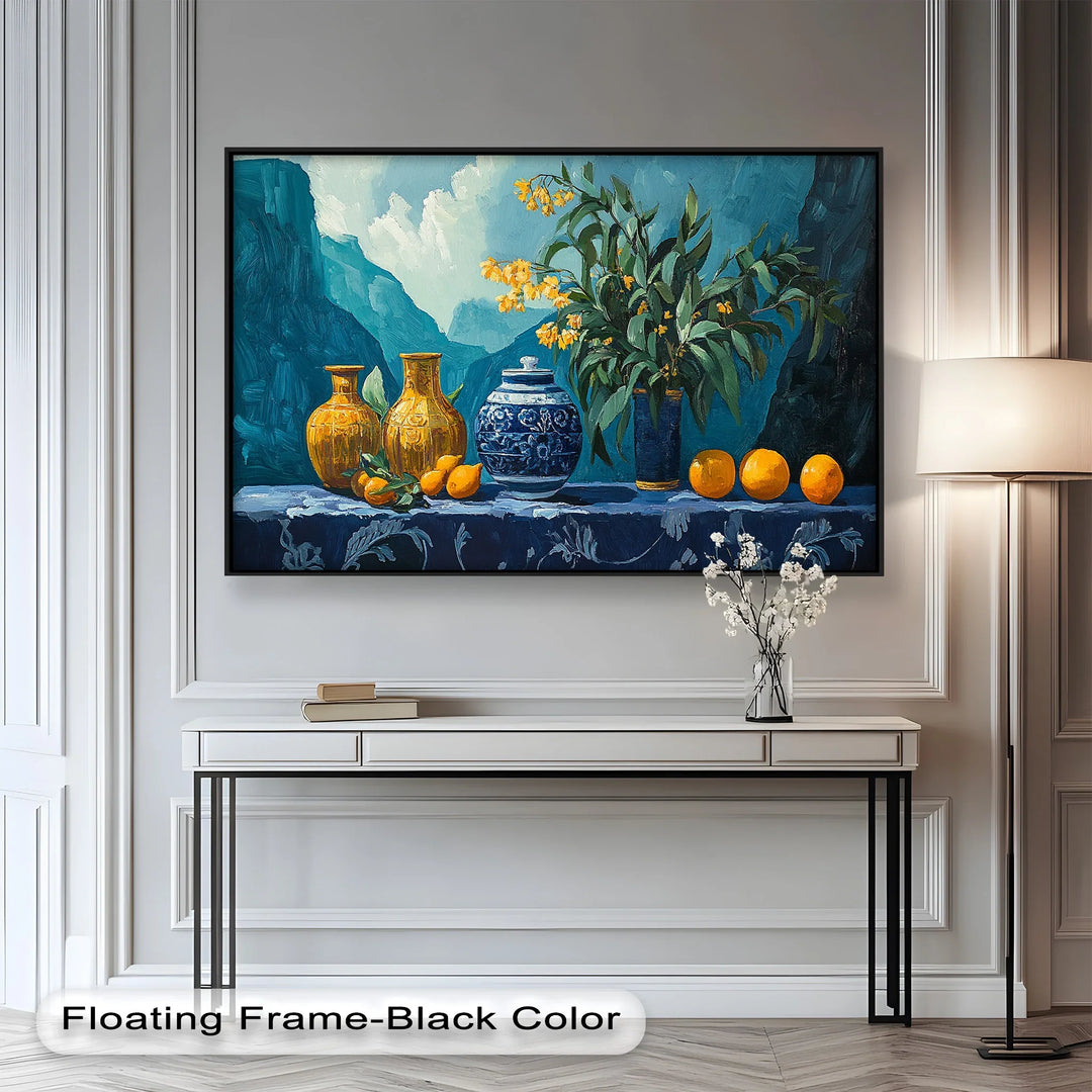 This vibrant still life painting features bold blue and yellow vases, fresh oranges, and delicate yellow flowers set against a majestic mountain backdrop.