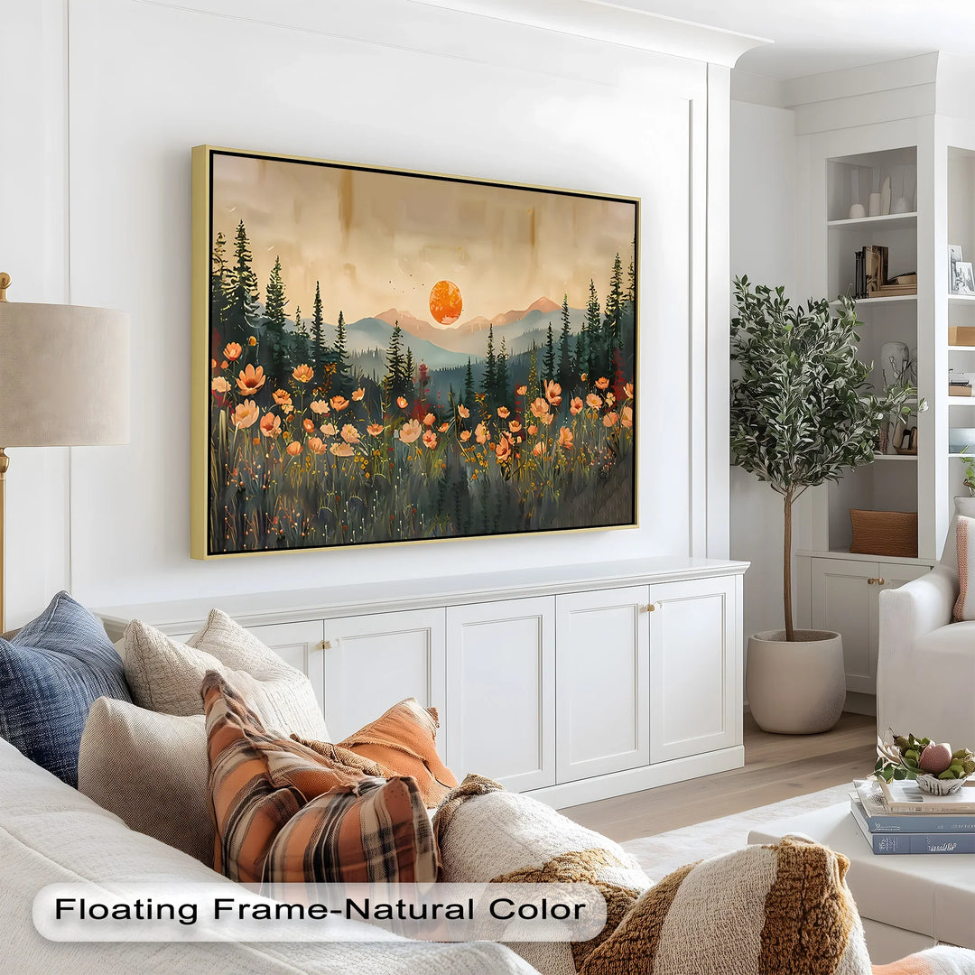 This dreamy landscape painting showcases a glowing orange sun setting behind mountain peaks and tall pine trees, with a foreground bursting in warm wildflowers.