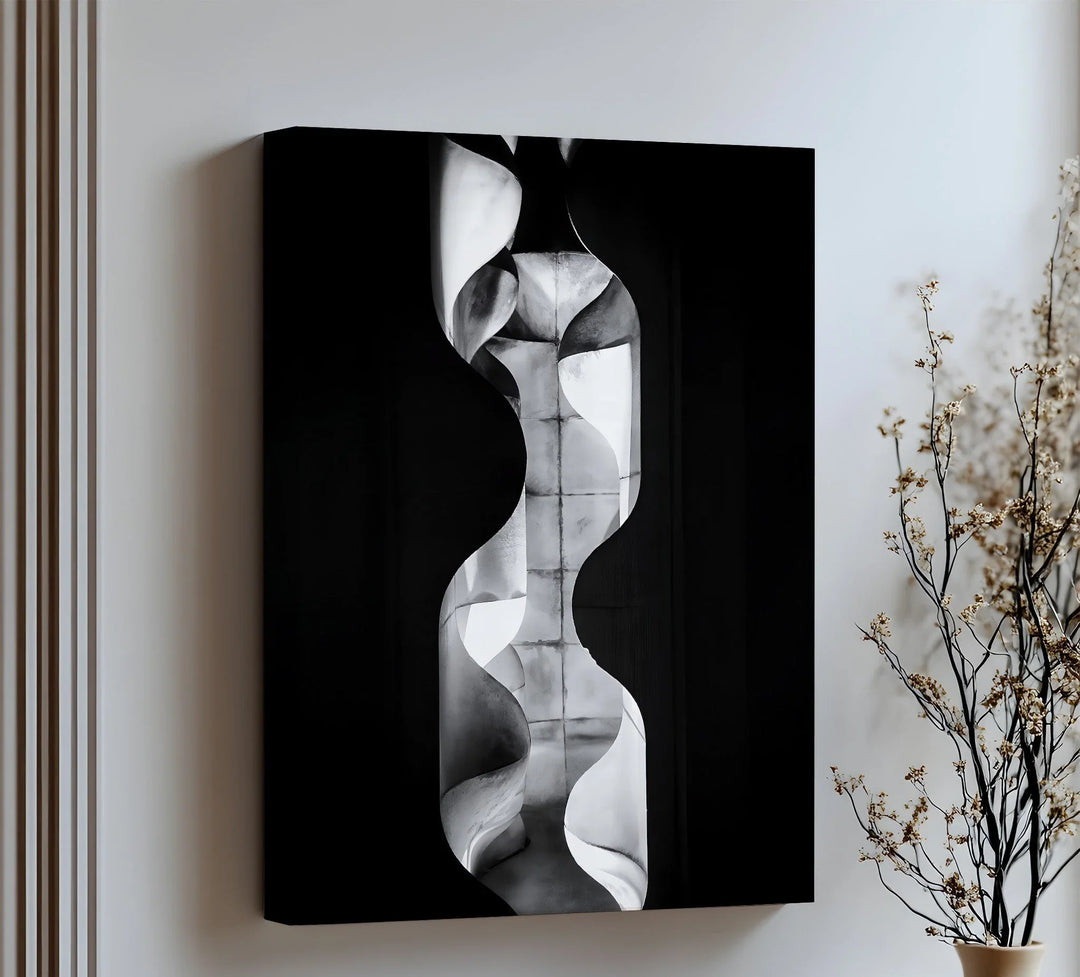Elevate your decor with this sculptural canvas wall art featuring fluid curves and industrial texture.