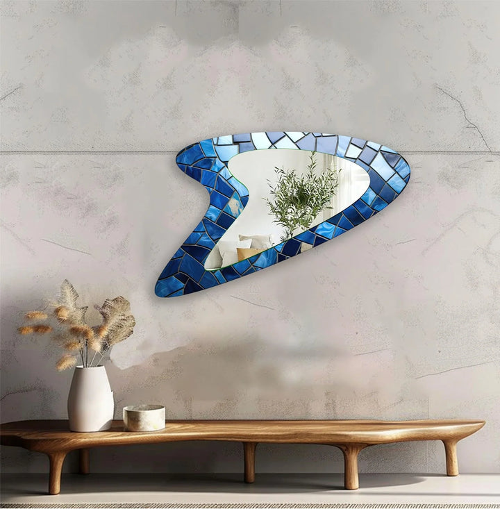 Decorative wall mirror with unique shapes and reflective surfaces for a chic statement