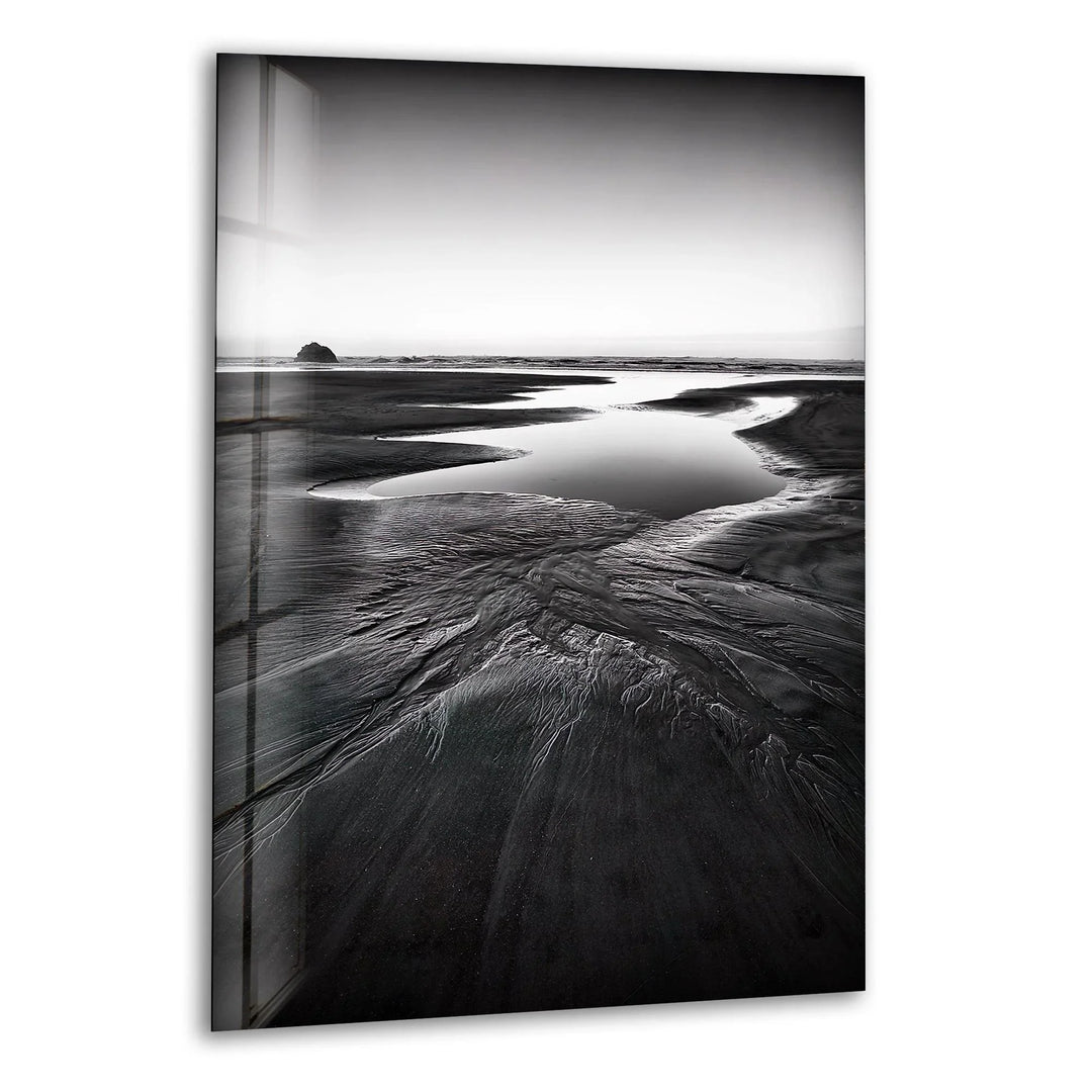 A breathtaking glass wall art featuring a monochrome beach landscape with serene coastal elements.
