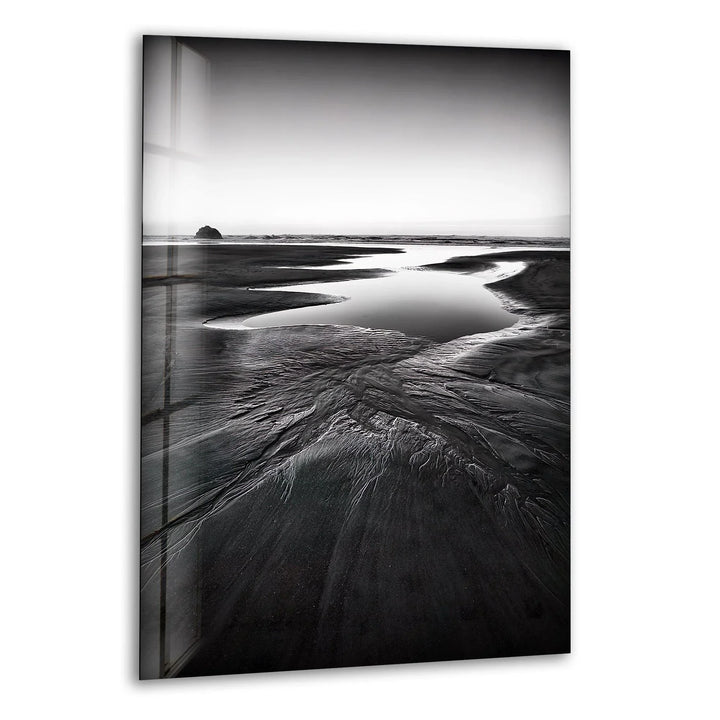 A breathtaking glass wall art featuring a monochrome beach landscape with serene coastal elements.
