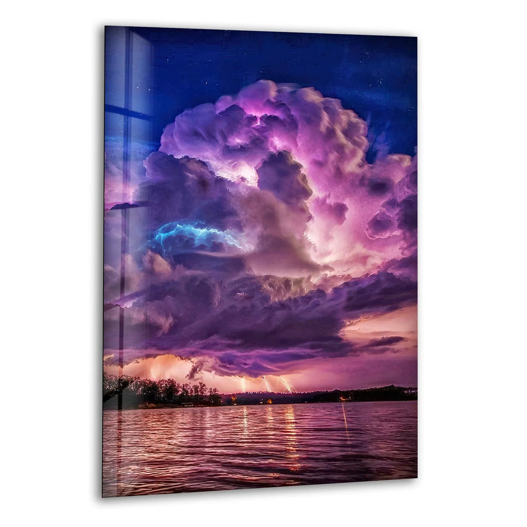 Dramatic storm clouds illuminated by lightning over a twilight sky, printed on glass wall art.
