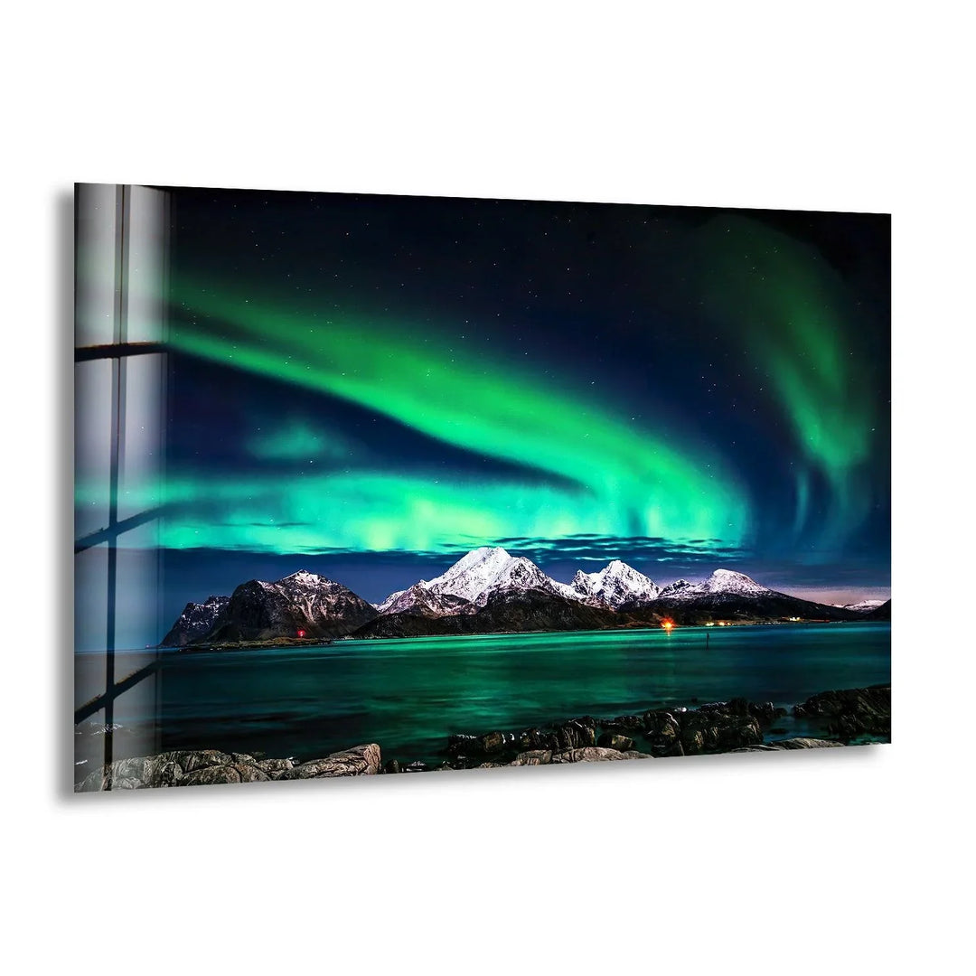 Breathtaking Northern Lights over snow-covered Arctic peaks, printed on glass wall art.
