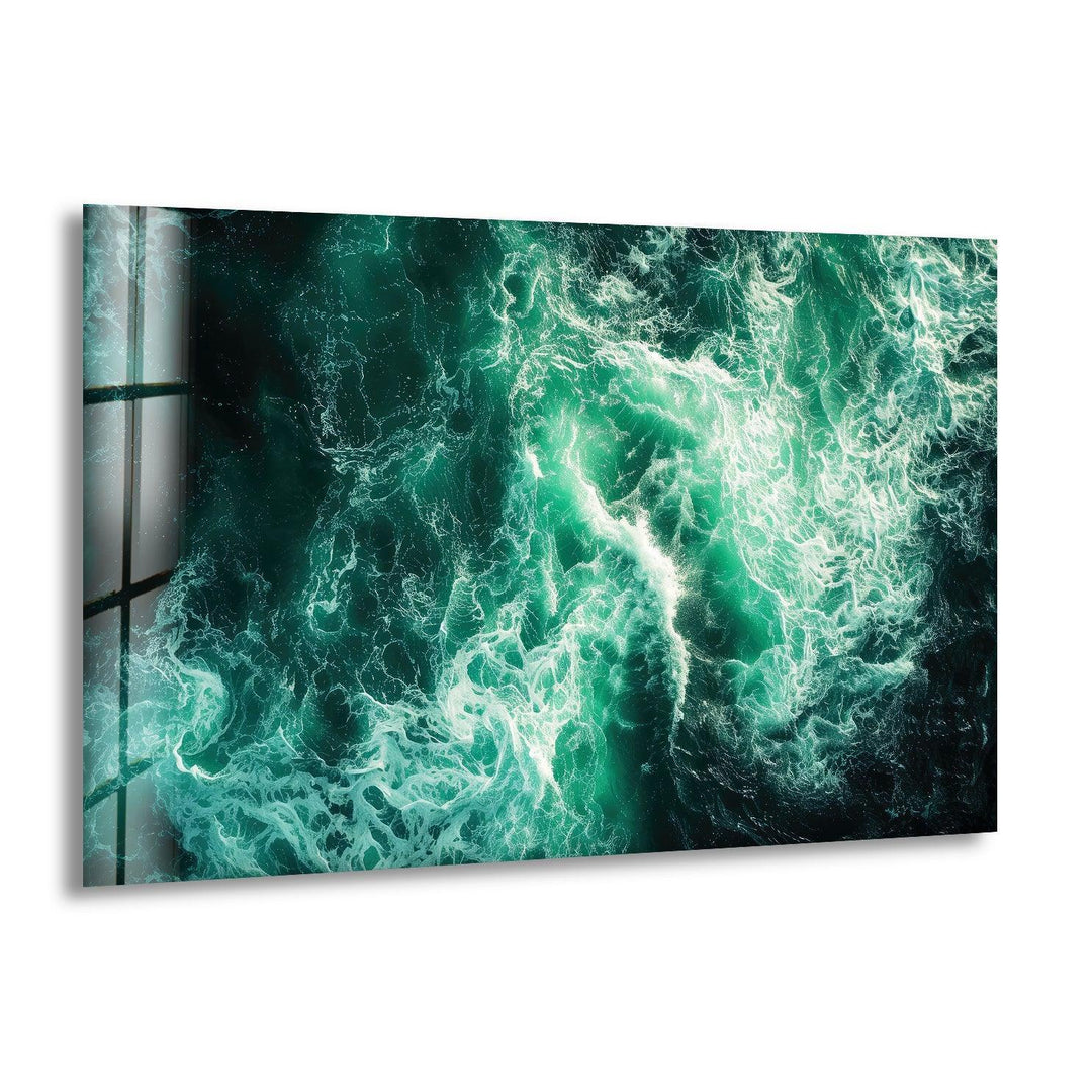 Stunning glass wall art featuring swirling turquoise ocean waves.