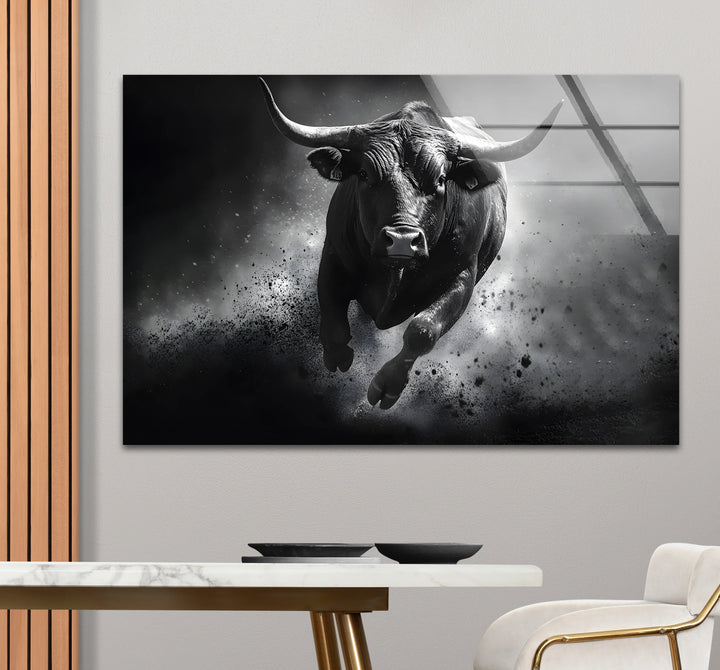 Modern black and white artwork highlighting the powerful movement of a bull in a minimalist design