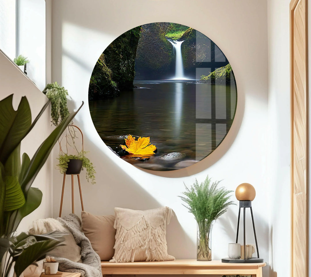Crystal-clear river with a cascading waterfall, surrounded by lush forest foliage.