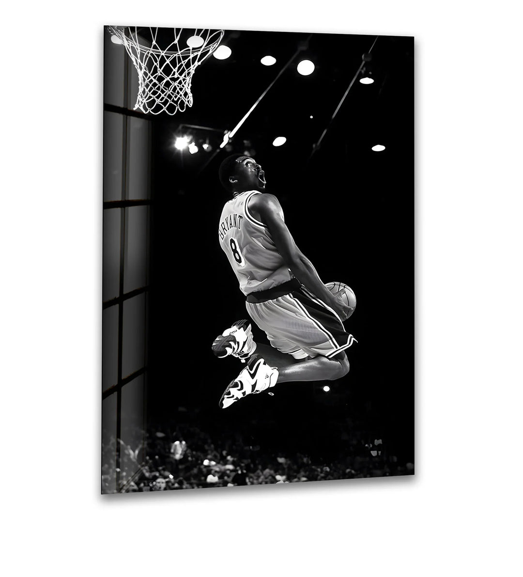 Experience the iconic moment of Kobe Bryant's powerful dunk captured in stunning black and white.