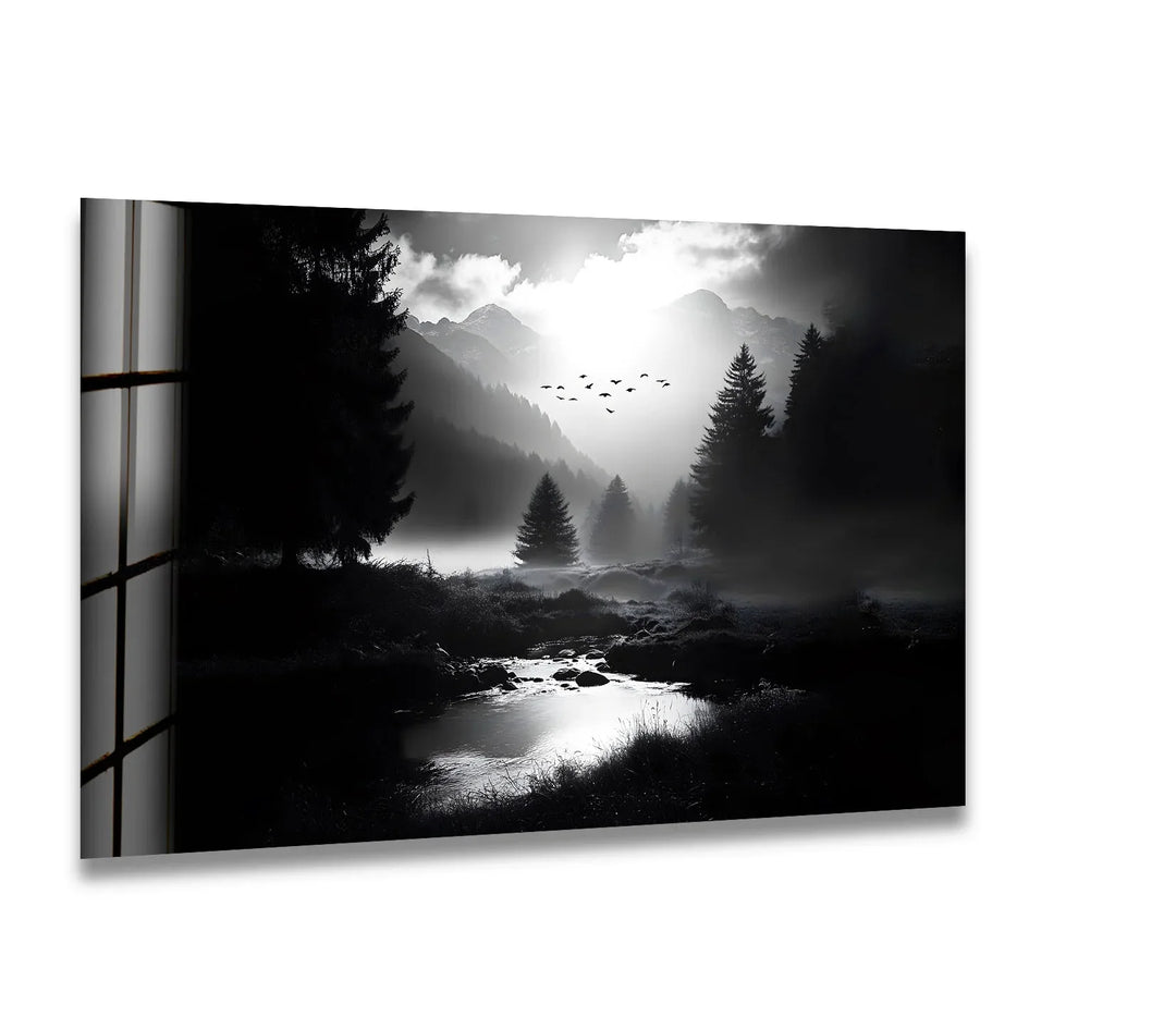 A breathtaking black and white glass wall art featuring misty mountains and a serene forest landscape.
