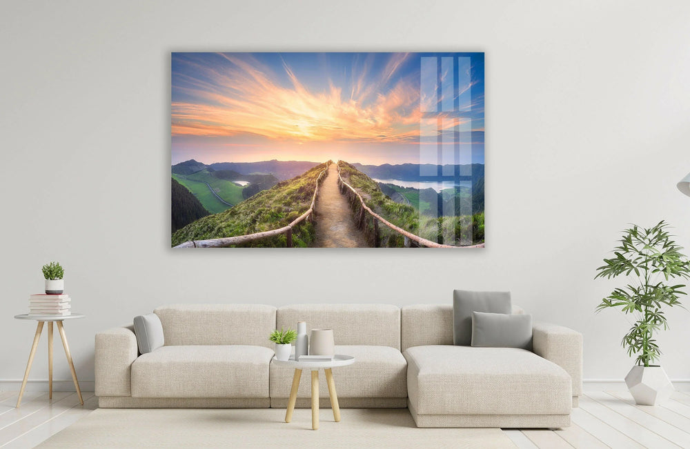 Golden sunrise over a winding mountain path, captured in a stunning glass wall print.