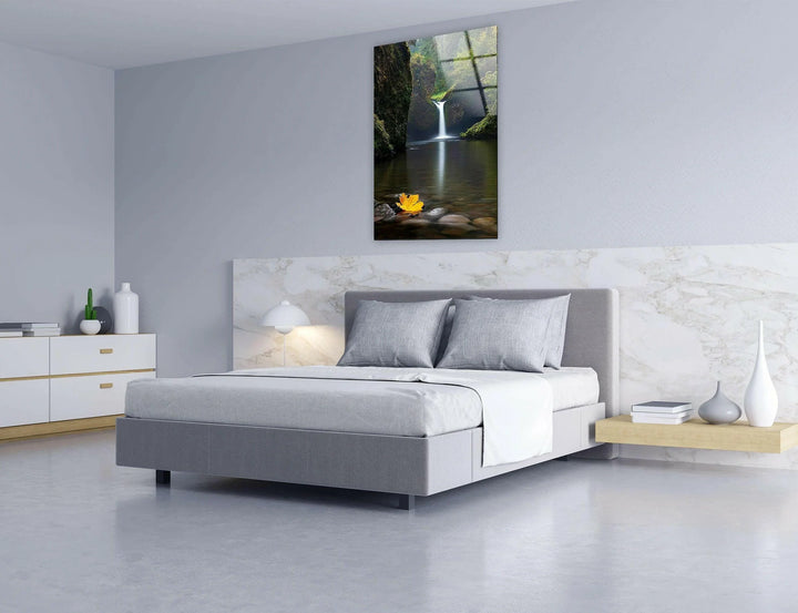 Elegant glass artwork capturing a nature retreat with a calming waterfall scene.