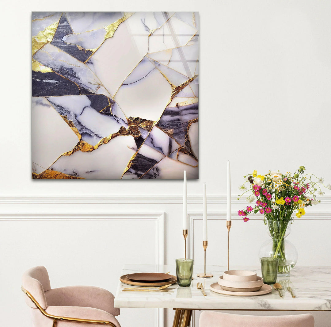 a dining room table with two chairs and a vase of flowers