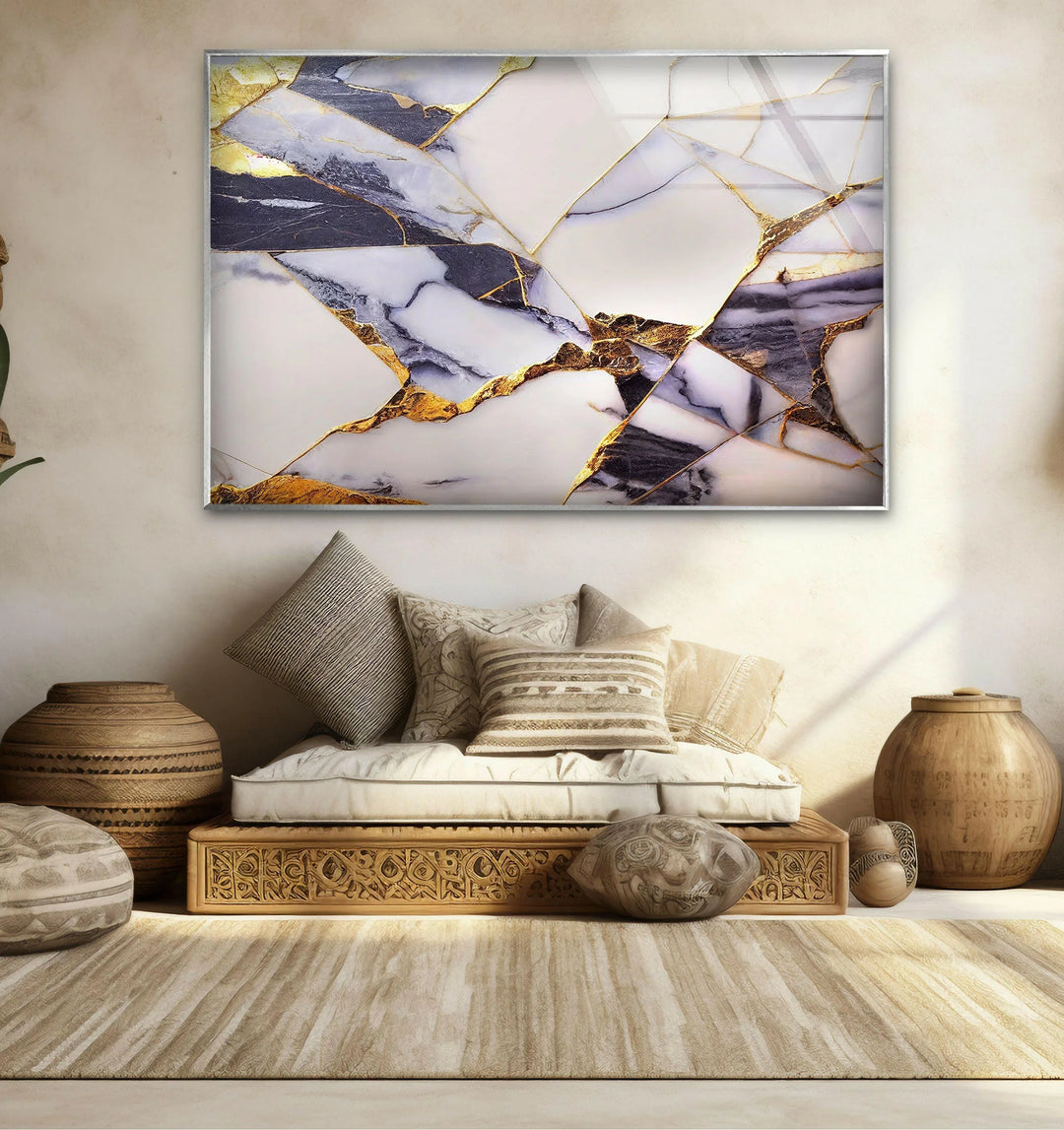 a living room with a couch and a painting on the wall