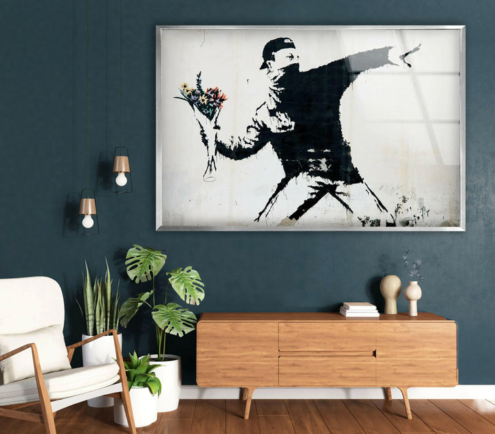 Flower Thrower Banksy Glass Wall Art - Our Banksy art for sale includes a variety of pieces, from famous works to unique interpretations, all meticulously printed on reinforced tempered glass. This medium not only enhances the vivid colors and intricate details of Banksy's work but also ensures durability and longevity. Ideal for both indoor and outdoor use, these pieces are versatile and built to last.