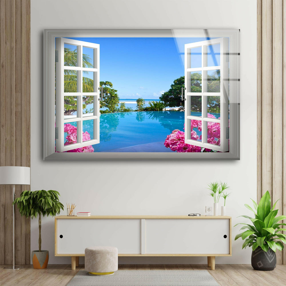 Serene beachside escape featuring an infinity pool, lush greenery, and crystal-clear water on glass wall art.
