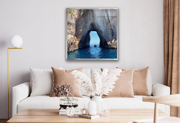 Luxury glass artwork displaying a scenic ocean view with a dramatic rock arch.
