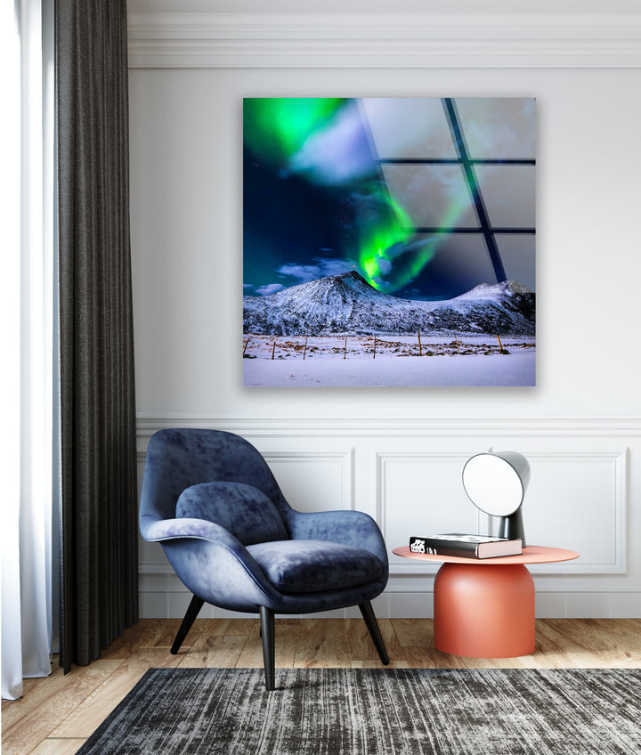 Luxury glass art print with glowing auroras reflecting off a snow-covered mountain range.
