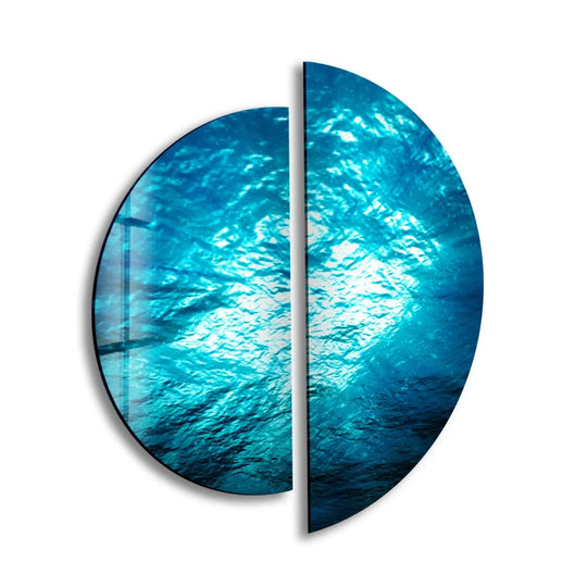 This 2 piece circle glass wall art features an ocean deep view and brings tranquil glass decor to your room with its ocean inspired design and wall decor motif