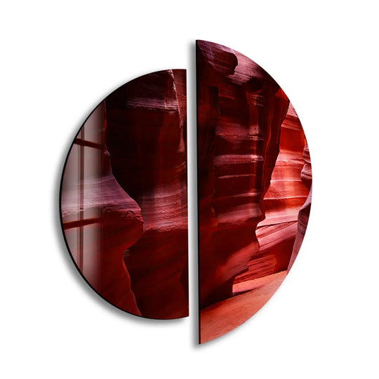 The softest element is the gentle gradient of light accentuating the depths of the canyon in this two piece round glass art.