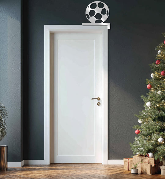 White edge and borders frame this metal decoration wall art of a sleek, sporty soccer ball design, creating a modern, impactful visual.