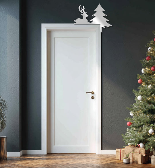 Sparkling silver decoration wall art featuring a reindeer and Christmas tree adds a festive touch above a bright white doorway.