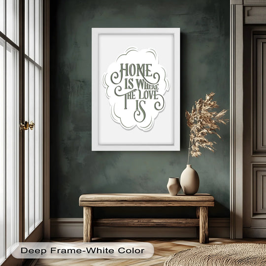 Displayed on a dark green wall, the framed central subject features an oil painting reproduction print with the inspirational saying 'Home Is Where the Love Is'.