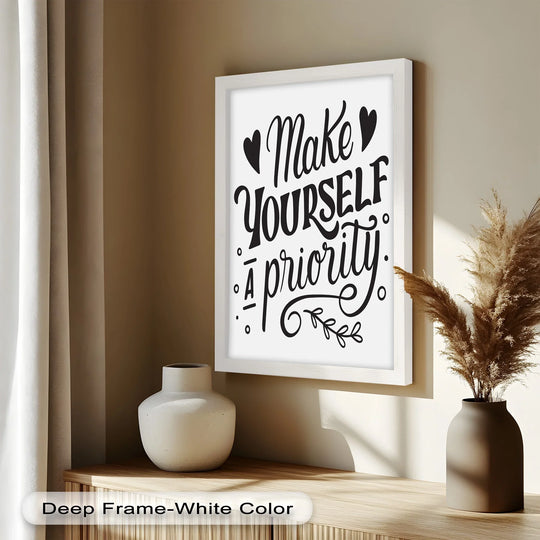 Gentle folds of the beige curtain softly illuminate the framed 'Make Yourself a Priority' oil painting artwork displayed with decorative vases on a wooden shelf.