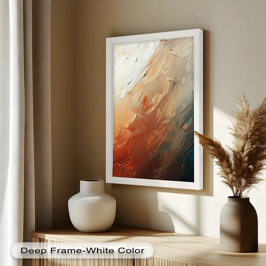 Foreground focus captures the earth-toned abstract oil painting decoration featuring textured brushstrokes and a deep frame in a modern living space.