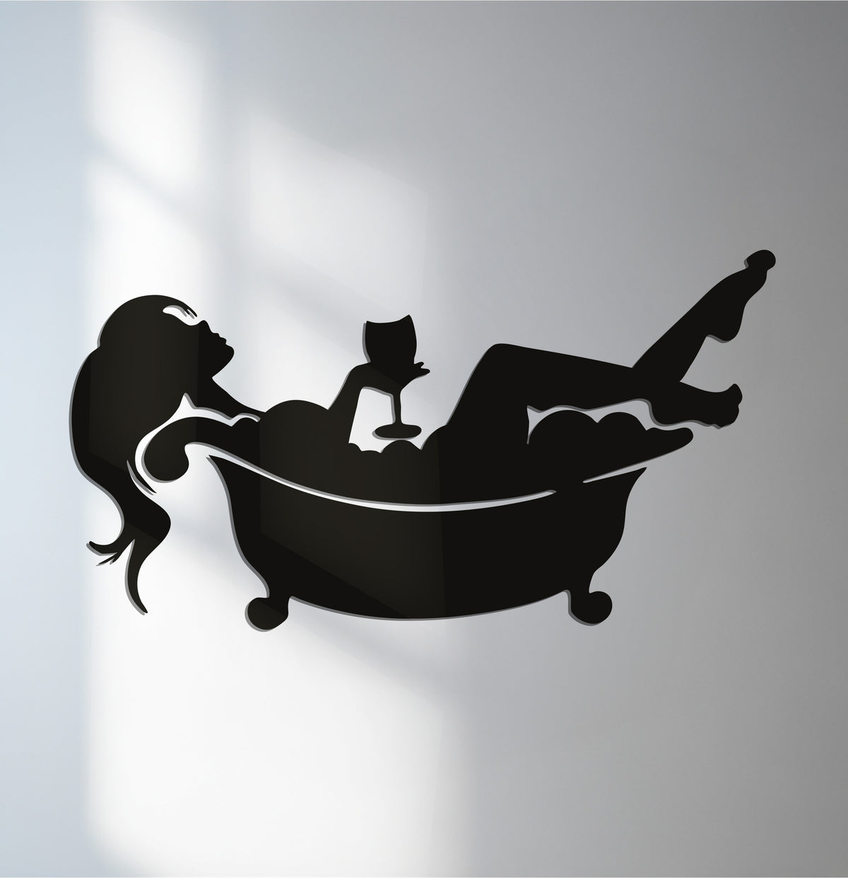 Subtle shadows emphasize the transition between colors in this relaxing bath silhouette, a piece of modern metal wall decor perfect for spa-inspired bathroom decor.