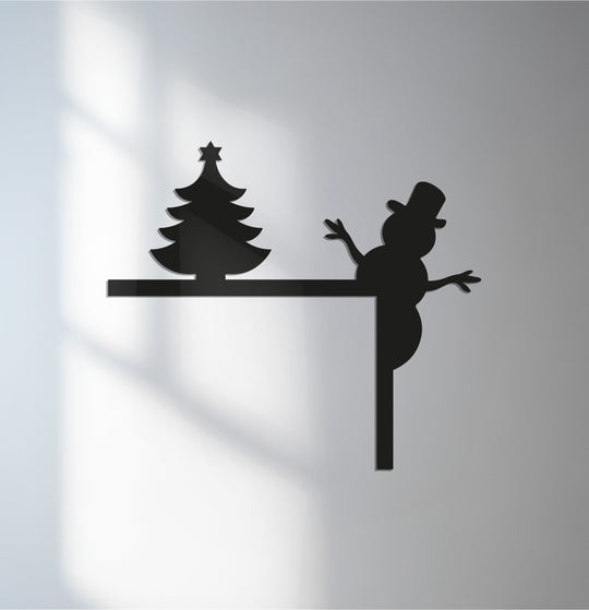 Silhouette decorative metal art showing a snowman and Christmas tree, bringing a festive and charming holiday accent.