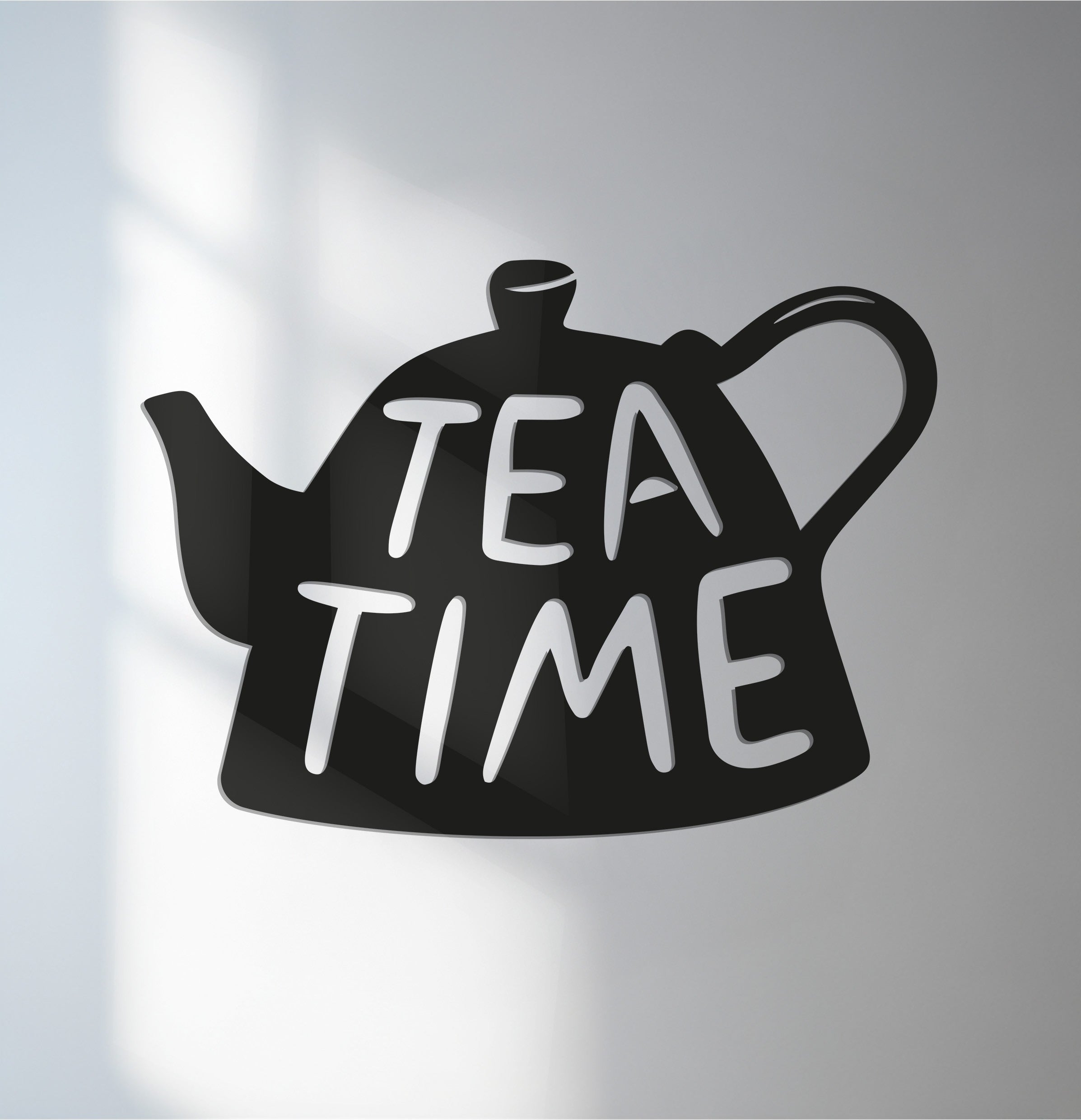 Defined by its bold edge and borders, this teapot-shaped unique metal wall art featuring “Tea Time” lettering is perfect for modern kitchen and café spaces.