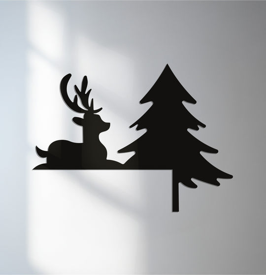 Cool shadows create an even color temperature, enhancing the minimalist silhouette of this silent reindeer and pine tree metal art for wall, a festive fireplace décor.
