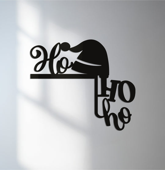 Smooth surface texture is evident in this matte black ho ho ho santa hat metal wall decor, creating an elegant holiday metal wall decor.