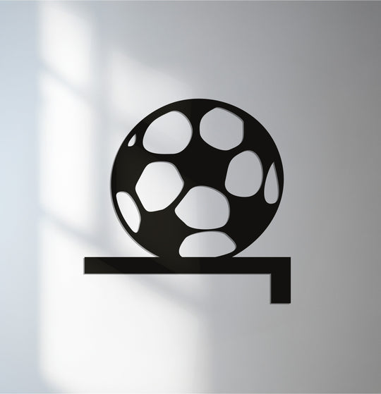 Black highlights the bold outline of this goal line soccer ball decorative metal art, creating a stark visual impact.