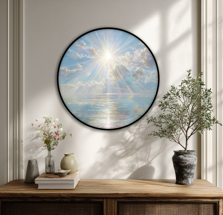 Layering celestial sun rays and clouds over a calm sea enhances the depth of this round luminous ocean wall art, a beautiful example of big canvas prints.