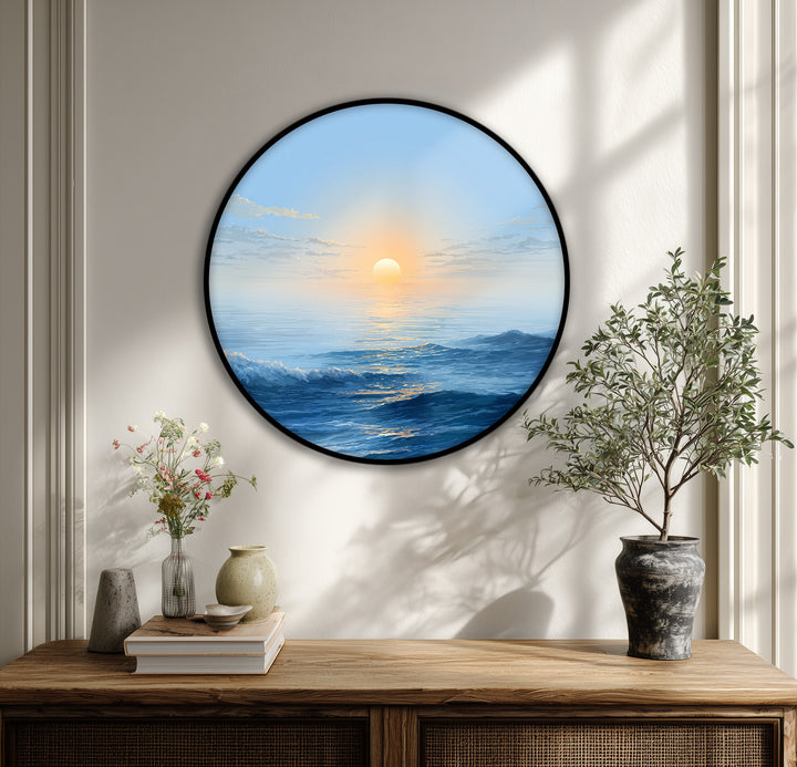 Crisp wall paneling and soft lighting enhance the minimalist ocean sunrise round canvas, complementing its serene canvas wall decor.