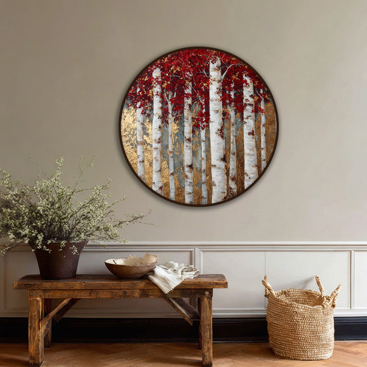 Serene hanging canvas depicts a golden birch forest with red leaves, radiating a peaceful and natural mood through its round design and elegant wall art.