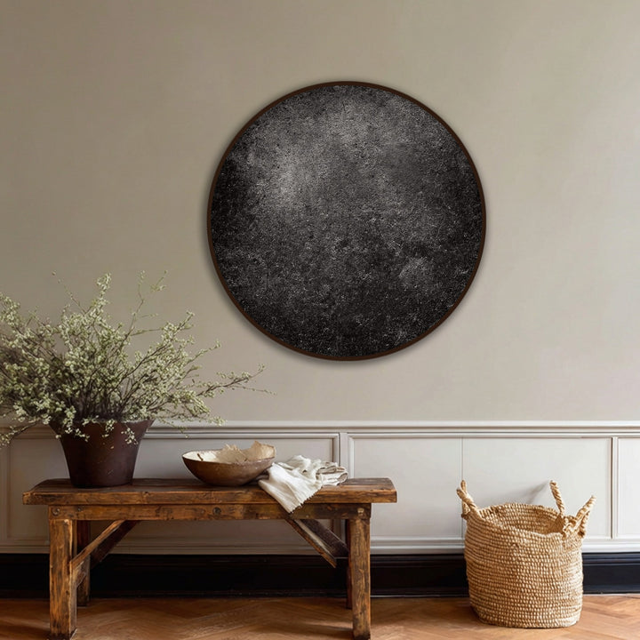 Negative space surrounds this round canvas print, showcasing the minimalist modern black wall art and creating a striking contrast for the high quality canvas prints.