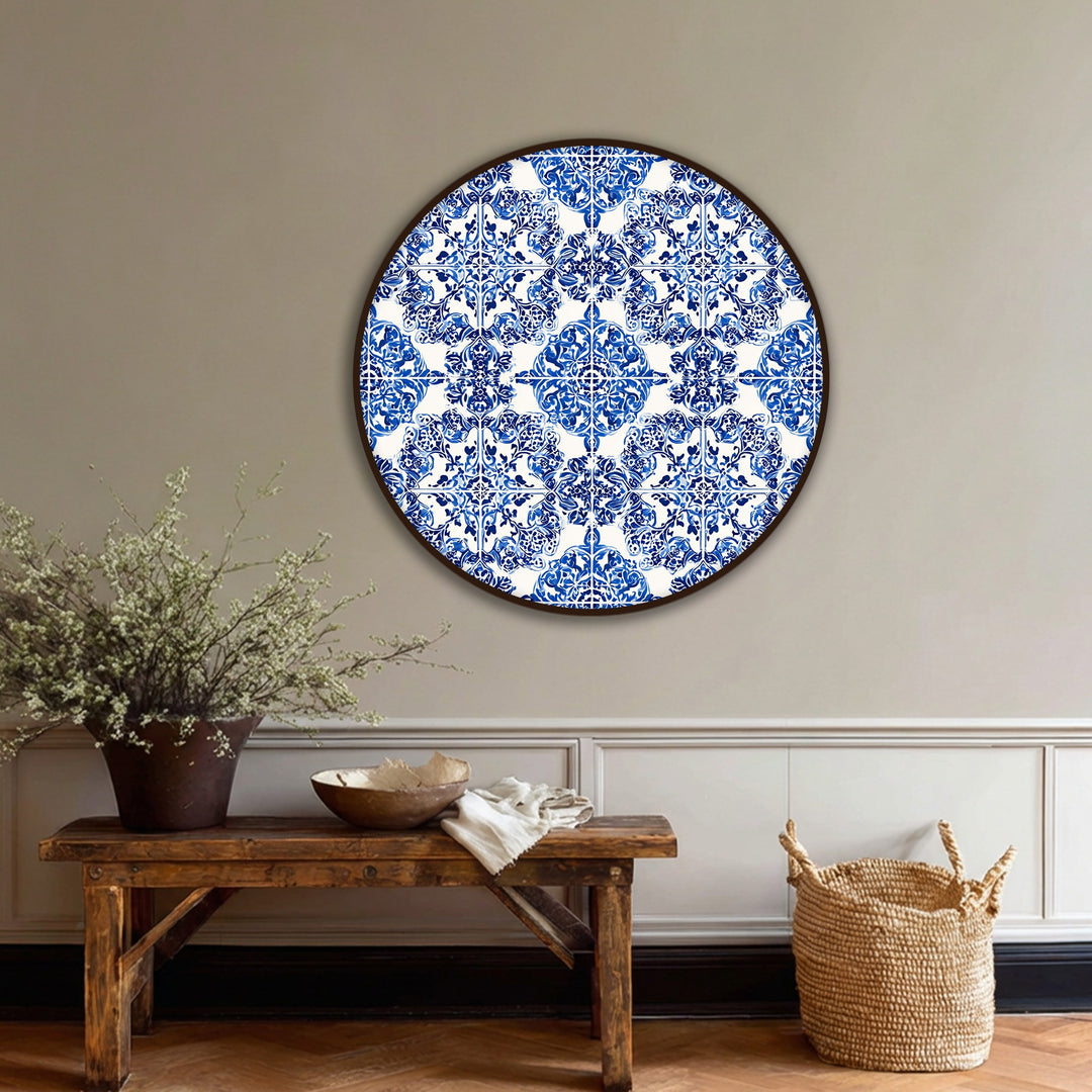 Shadows play across the blue ornamental tile pattern of this round canvas wall art, highlighting the textured details in this stunning canvas wall art.