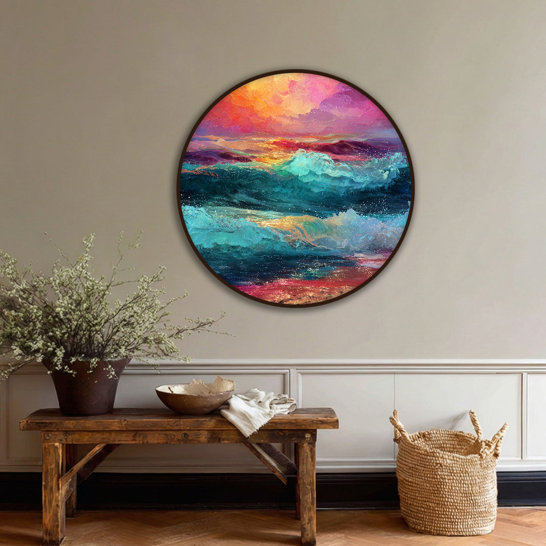 Vivid sunset sky and crashing waves dominate this round canvas painting, adding a colorful ocean wall art element to the room.