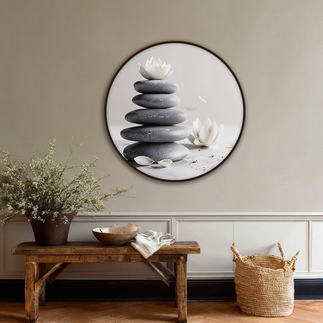 Falling petals around stacked stones and lotus flowers capture the serene movement in this zen balance stones with lotus round canvas print, one of the best canvas prints for spa decor.