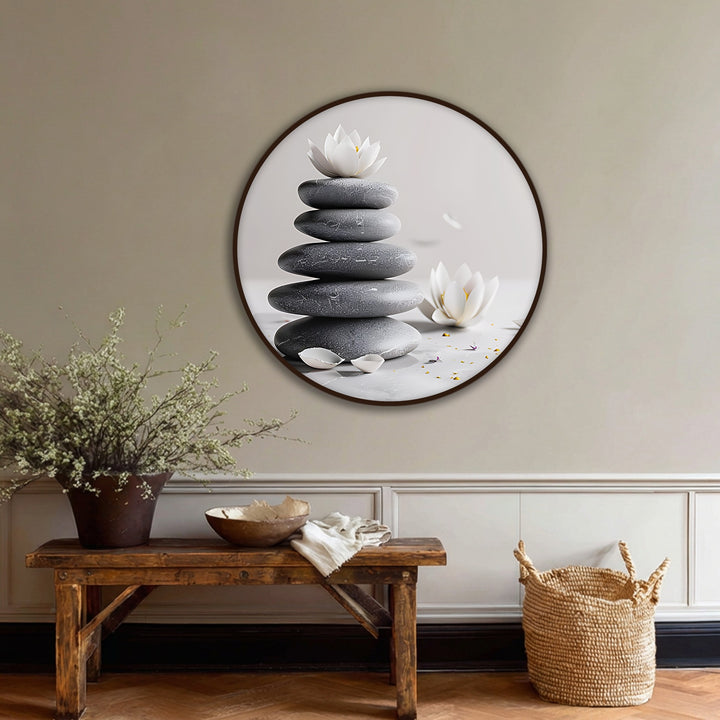 Falling petals around stacked stones and lotus flowers capture the serene movement in this zen balance stones with lotus round canvas print, one of the best canvas prints for spa decor.