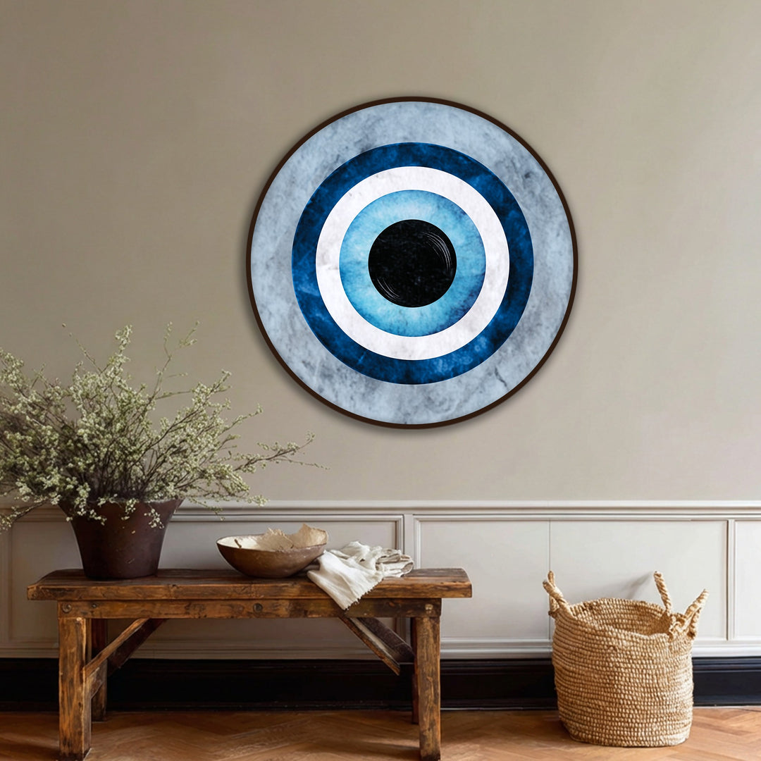 With a matte finish, the blue evil eye symbol on this round canvas wall art displays a textural look perfect for minimalist canvas wall art.