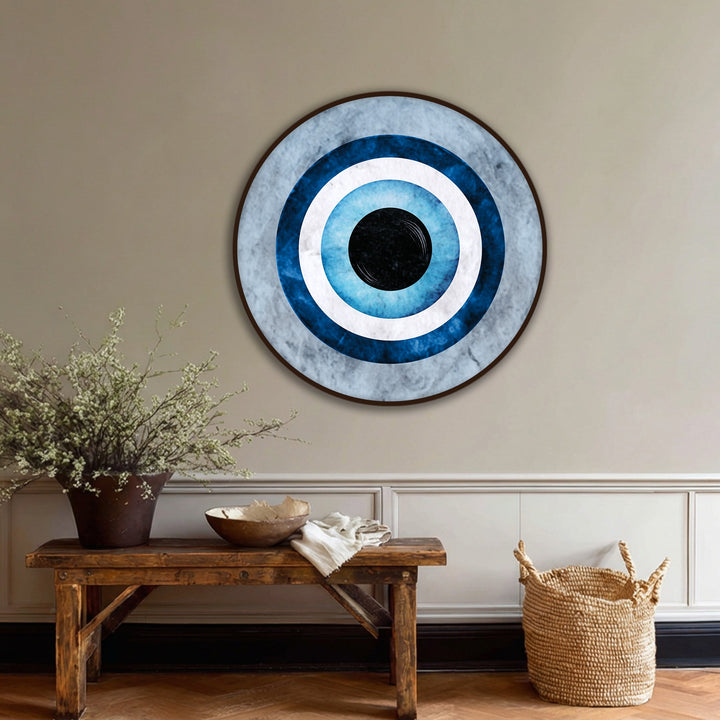 With a matte finish, the blue evil eye symbol on this round canvas wall art displays a textural look perfect for minimalist canvas wall art.