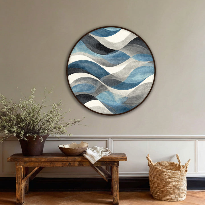Dominant azure and gray hues accentuate the flowing design of this abstract round canvas print, offering unique canvas artwork with a modern coastal feel.