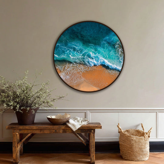 Showcasing the layering effect, this turquoise ocean wall art on hanging canvas features the beautiful textures of aerial beach waves as they meet the sandy shore.