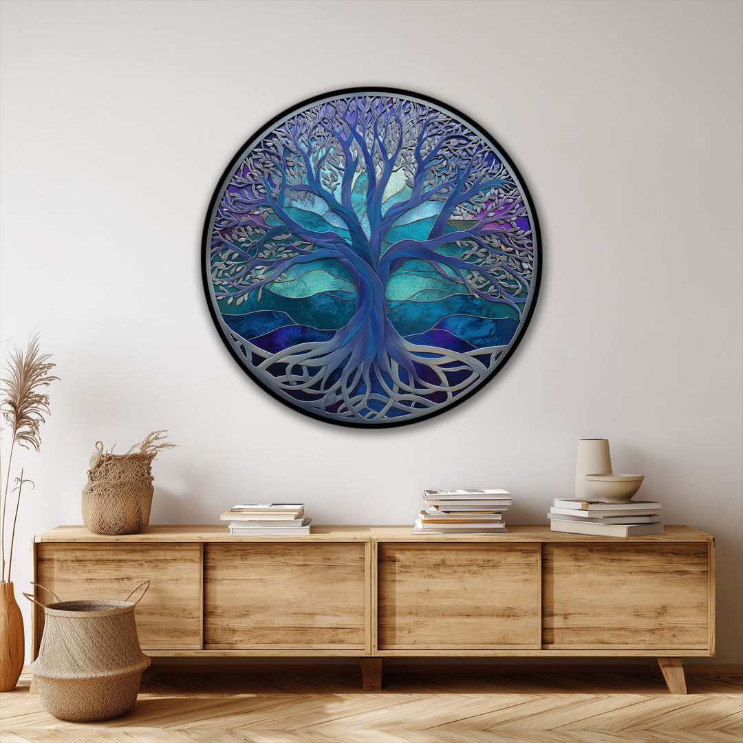 The organic forms of the Mystic Blue Tree of Life round canvas pictures evoke natural growth with intertwining roots and branching limbs in abstract detail.