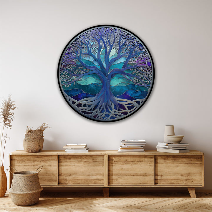 The organic forms of the Mystic Blue Tree of Life round canvas pictures evoke natural growth with intertwining roots and branching limbs in abstract detail.