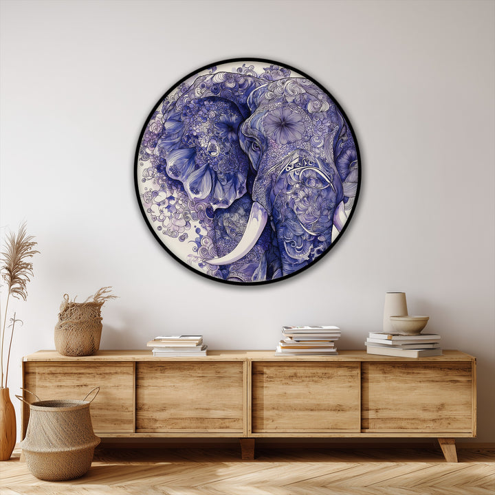 Subtle negative space surrounds this round canvas wall decor showcasing an intricate blue elephant illustration, highlighting its artistic patterns and the wildlife's form.