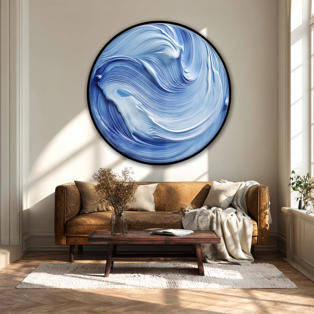 The canvas wall art displays a striking, high color saturation, emphasizing the swirling ocean flow in this blue abstract round canvas print.